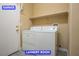 Bright laundry room features a functional layout with a washing machine, dryer and overhead shelf at 9710 Geiger Peak Ct, Las Vegas, NV 89148