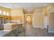Bright, open-concept living space features a kitchen with stainless appliances and island at 9710 Geiger Peak Ct, Las Vegas, NV 89148