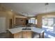 Open floor plan featuring an eat-in kitchen island and views into the living and dining area at 9710 Geiger Peak Ct, Las Vegas, NV 89148