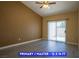 The main bedroom features wood floors, ceiling fan, and sliding doors at 9710 Geiger Peak Ct, Las Vegas, NV 89148