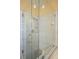 Modern shower with clear glass enclosure, shelving alcoves, and contemporary fixtures at 9710 Geiger Peak Ct, Las Vegas, NV 89148