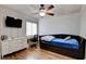 Charming bedroom features a ceiling fan, wood floors, and a cozy daybed at 982 Flapjack Dr, Henderson, NV 89014