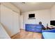 This cozy bedroom features wood flooring, closet space, and a modern ceiling fan at 982 Flapjack Dr, Henderson, NV 89014
