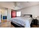 Relaxing bedroom features a ceiling fan, wood floors and an abundance of natural light at 982 Flapjack Dr, Henderson, NV 89014