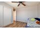 This bright bedroom with hardwood floors features a closet for plenty of storage at 982 Flapjack Dr, Henderson, NV 89014