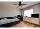 Cozy bedroom with ceiling fan and wood floors provides a comfortable retreat at 982 Flapjack Dr, Henderson, NV 89014