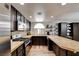 Well-lit kitchen with stainless steel appliances, countertop bar and ample cabinet space at 982 Flapjack Dr, Henderson, NV 89014