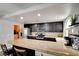 Spacious kitchen featuring stainless steel appliances, stone countertops, and dark cabinetry at 982 Flapjack Dr, Henderson, NV 89014