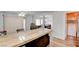 Open kitchen design with a breakfast bar overlooking the dining area and backyard access at 982 Flapjack Dr, Henderson, NV 89014