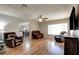 Inviting living room featuring hardwood floors, comfortable seating, and abundant natural light at 982 Flapjack Dr, Henderson, NV 89014
