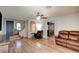 Inviting living room featuring hardwood floors, comfortable seating, and abundant natural light at 982 Flapjack Dr, Henderson, NV 89014