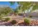 Well-maintained backyard featuring desert landscaping, mature trees and a peaceful atmosphere at 10201 Premia Pl, Las Vegas, NV 89135