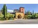 Elegant clubhouse featuring colorful architecture, lush landscaping, and inviting entrance at 10201 Premia Pl, Las Vegas, NV 89135