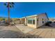Back of the house with patio area and desert landscaping at 10201 Premia Pl, Las Vegas, NV 89135