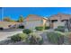 Charming single story home featuring a two-car garage, gated entry, desert landscaping, and neutral color palette at 10201 Premia Pl, Las Vegas, NV 89135