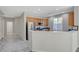 Kitchen featuring stainless steel appliances, wood cabinets, tile floors, and a breakfast bar perfect for entertaining at 10201 Premia Pl, Las Vegas, NV 89135