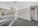 Spacious living room with large windows offering natural light and pleasant views of the outdoors at 10201 Premia Pl, Las Vegas, NV 89135