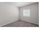 Cozy bedroom featuring neutral walls, plush carpeting, and one window offering plenty of natural light at 10257 Sequoia Falls Pl, Las Vegas, NV 89149