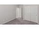 This bedroom features neutral walls, carpeted floors, and double door closet at 10257 Sequoia Falls Pl, Las Vegas, NV 89149