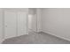 This bedroom features neutral walls, carpeted floors, and double door closet at 10257 Sequoia Falls Pl, Las Vegas, NV 89149