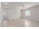 Spacious empty room with tile flooring, neutral walls, and ample natural light from the window at 10257 Sequoia Falls Pl, Las Vegas, NV 89149