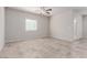 Bright, airy empty room with tile flooring and a large window offering natural light at 10257 Sequoia Falls Pl, Las Vegas, NV 89149