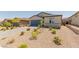 Single-story home with a xeriscaped front yard and a two-car garage at 10257 Sequoia Falls Pl, Las Vegas, NV 89149