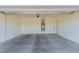Spacious two car garage with concrete floors, hot water tank, and white painted walls at 10257 Sequoia Falls Pl, Las Vegas, NV 89149
