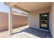 Covered outdoor patio features a brick wall, concrete pillar, and paved stone at 10257 Sequoia Falls Pl, Las Vegas, NV 89149