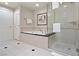 Bright bathroom with a large bathtub and shower, with white tile at 125 E Harmon Ave # 321, Las Vegas, NV 89109