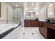 Bright bathroom with a large bathtub and shower, and double vanities at 125 E Harmon Ave # 321, Las Vegas, NV 89109