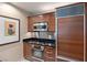 Modern kitchen with stainless steel appliances, sleek cabinetry, and updated fixtures and fittings at 125 E Harmon Ave # 321, Las Vegas, NV 89109