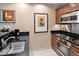Charming kitchen featuring stainless steel appliances, dark countertops, and modern fixtures at 125 E Harmon Ave # 321, Las Vegas, NV 89109