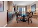 Refined condo living area with a stylish glass dining table and modern dark wood furnishings at 125 E Harmon Ave # 321, Las Vegas, NV 89109
