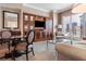 Cozy living area features refined seating, elegant built-ins, and breathtaking city views from the large windows at 125 E Harmon Ave # 321, Las Vegas, NV 89109