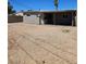 The backyard features a large gravel area and a covered patio at 131 Copper St, Henderson, NV 89015