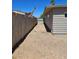 Spacious backyard area with gravel, surrounded by a wooden fence, offering privacy and potential for customization at 131 Copper St, Henderson, NV 89015