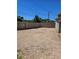 Backyard with gravel groundcover, featuring a mix of wood and block fencing for privacy and security at 131 Copper St, Henderson, NV 89015