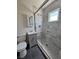 Stylish bathroom features a glass enclosed shower with elegant tile work and modern fixtures at 131 Copper St, Henderson, NV 89015