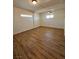 Spacious bedroom features new floors, bright light, and a ceiling fan at 131 Copper St, Henderson, NV 89015