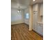 Well-lit dining room with light fixture, window and wood flooring at 131 Copper St, Henderson, NV 89015