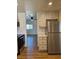 Kitchen area with modern stainless steel refrigerator and backyard access at 131 Copper St, Henderson, NV 89015
