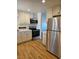 Modern kitchen features stainless steel appliances and beautiful wood flooring at 131 Copper St, Henderson, NV 89015