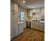 Charming kitchen with stainless steel appliances, wood flooring and access to the backyard at 131 Copper St, Henderson, NV 89015
