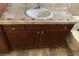 Bathroom vanity with a white sink and faucet, cabinet storage, and tiled countertop at 1712 Matador Way, Las Vegas, NV 89128