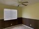 Bedroom featuring a ceiling fan and large window at 1712 Matador Way, Las Vegas, NV 89128