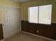 Bedroom with a closet and large window at 1712 Matador Way, Las Vegas, NV 89128