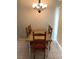 Cozy dining room featuring a chandelier and wood table and chairs at 1712 Matador Way, Las Vegas, NV 89128