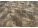 Detailed view of the neutral-colored tile flooring with a textured, natural stone appearance at 1712 Matador Way, Las Vegas, NV 89128