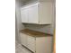 Kitchen cabinets featuring white doors and granite counter tops at 1712 Matador Way, Las Vegas, NV 89128
